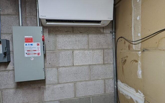 A wall mounted air conditioner in Elevator room in Colorado