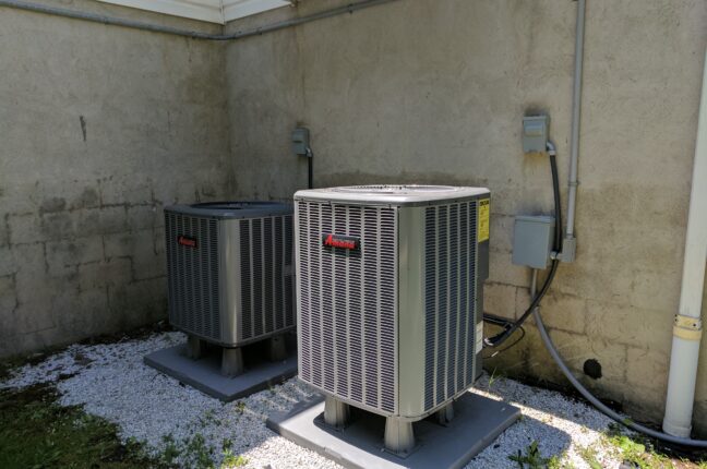 Two outdoor central AC condensers