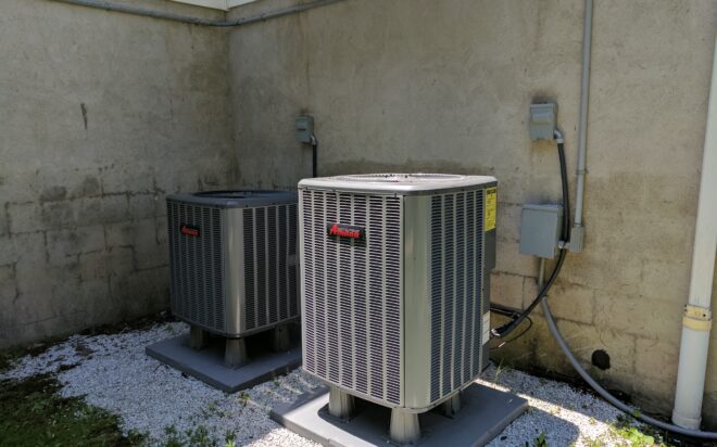 Two outdoor central AC condensers