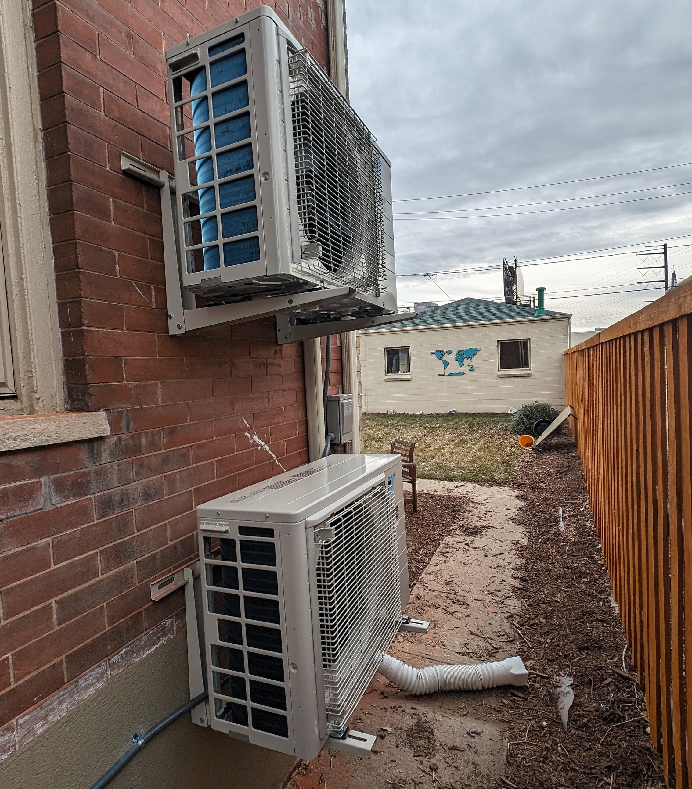 Central AC Condensers on a wall.