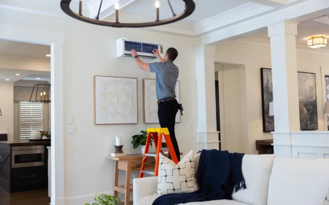 A tech installing a Ductless AC in Denver, Colorado