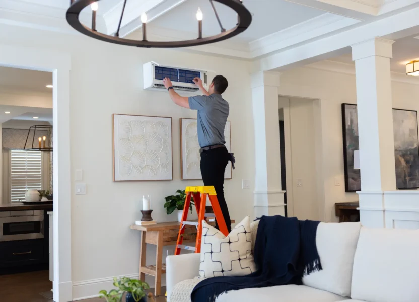 A tech installing a Ductless AC in Denver, Colorado