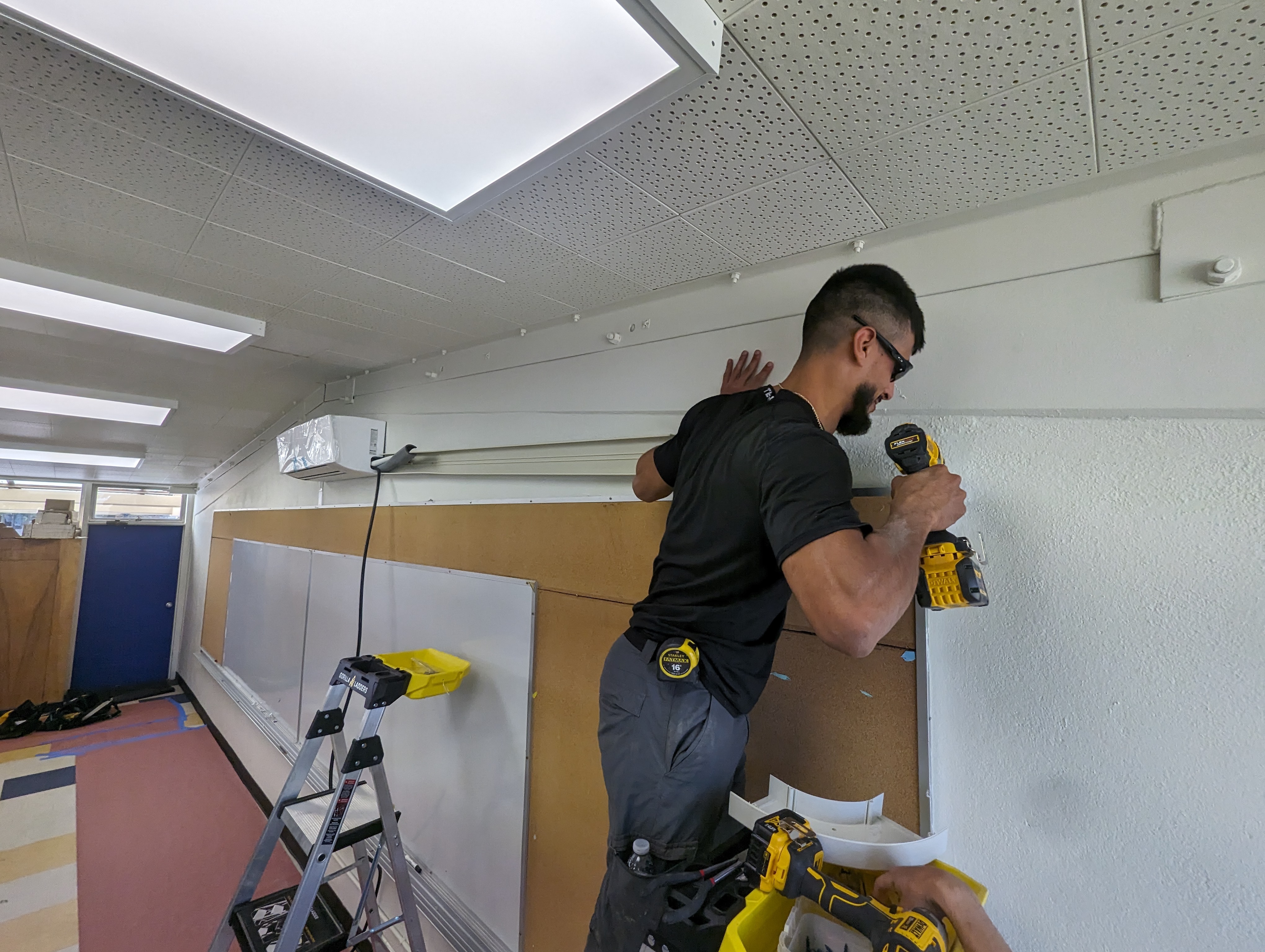 A Bronco Breeze tech installing a Split AC unit.